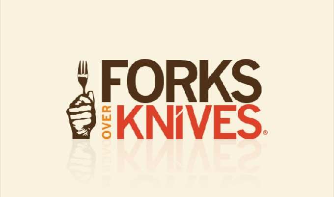 Vegan Movie poster of Forks Over Knives a documentary about a how a vegan diet can treat and reverse chronic diseases it shows a fist holding a fork